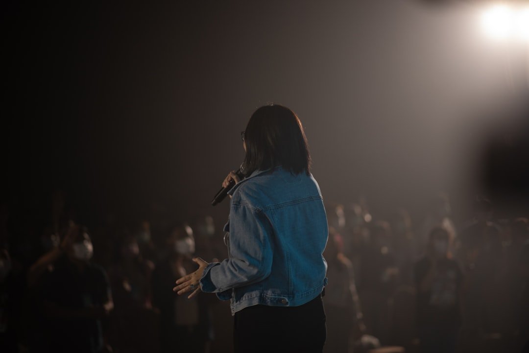 Person speaking into a microphone